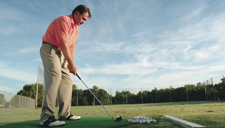 Man practicing golf