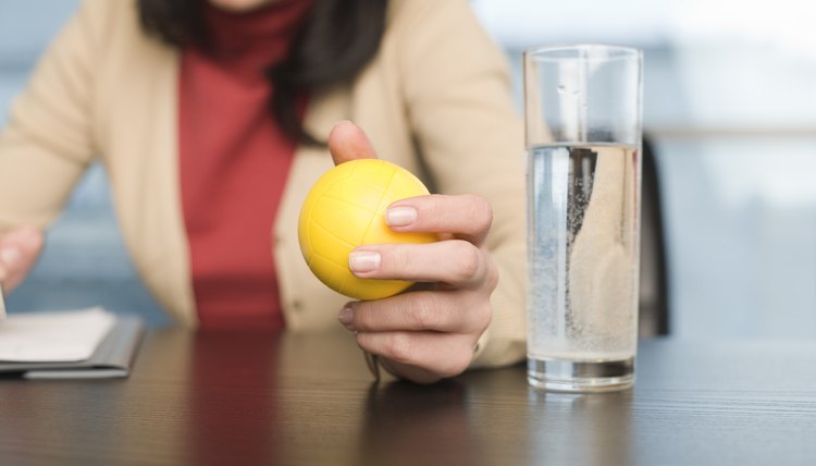 Businesswoman holding stress ball