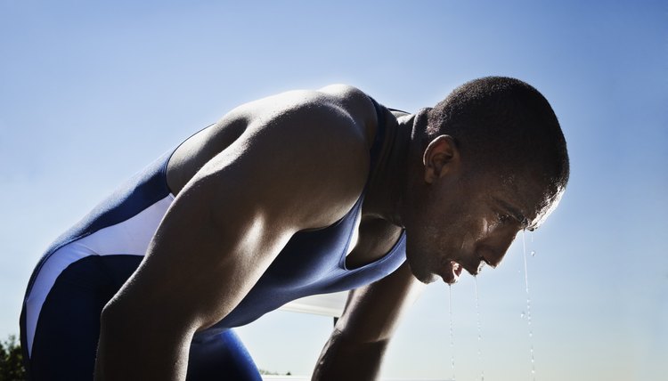 Athletic man resting after race