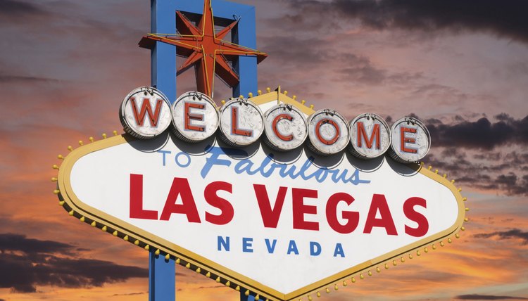 A welcome to Las Vegas sign at sunset.