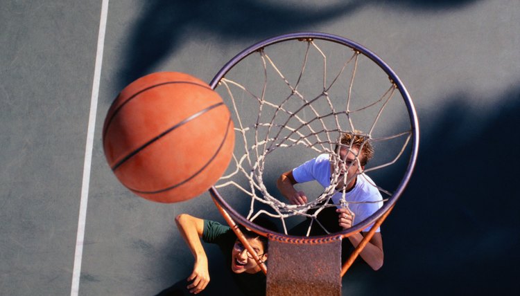 Two Teenage Boys Playing Basketball