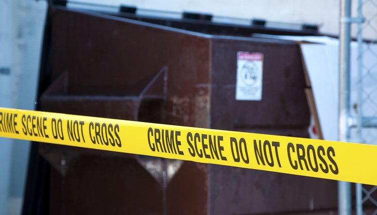 Crime scene tape at site of a crime.