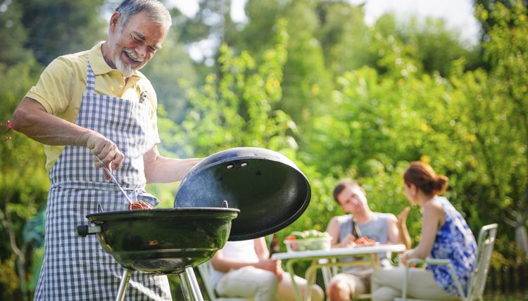 Man barbecuing meat.