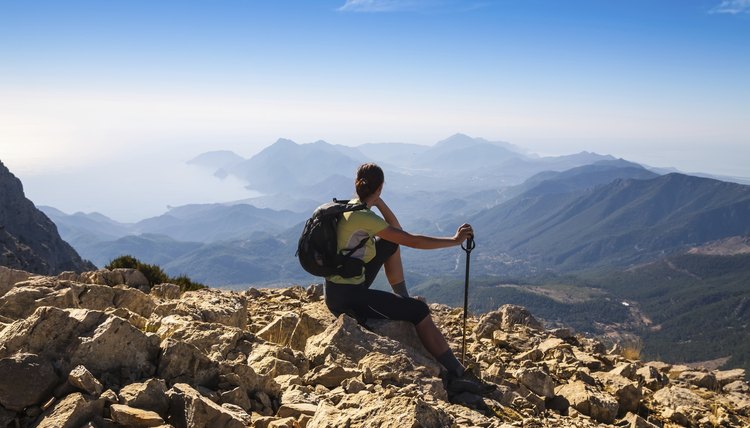 tourist woman on the top of mount,