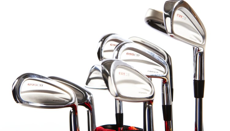 Golf clubs against white background