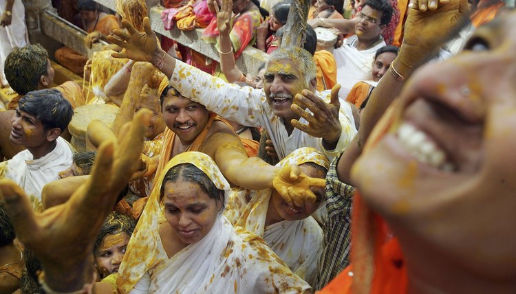 Jain devotees dance during a festival.