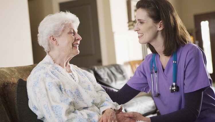 Nurse smiling with patient at home