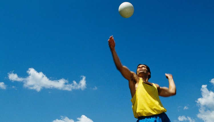 Man serving volleyball