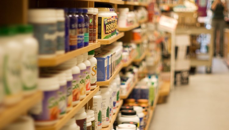 Products on shelves in aisle of health foods store