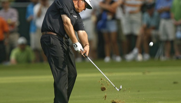 Phil Mickelson's divot proves he hits down through the ball at impact.