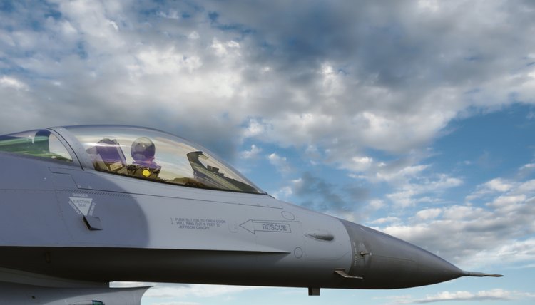 An air force pilot sits in an F-16 Fighting Falcon.