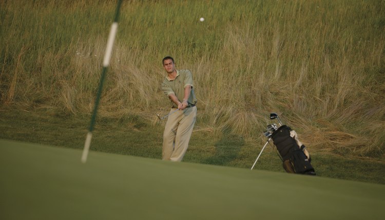 Chipping from a tight lie to the green.