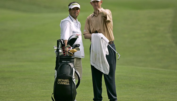 Golf professional Michael Connell makes sure his grips are dry so he doesn't lose control at the top of his swing.