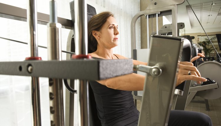 Woman on weight machine