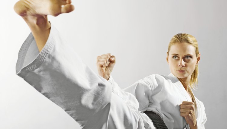 Woman performing martial arts kick