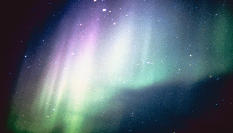 Auroras are caused by sunspots, which release plasma that collides with the atmosphere.