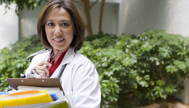doctor holding books and folders