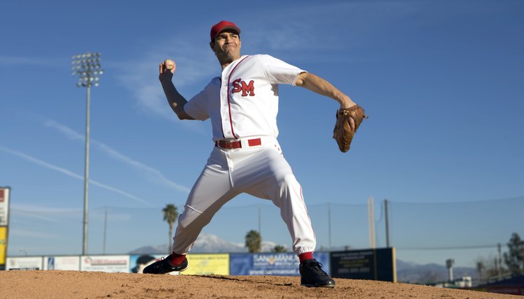 USA, California, San Bernardino, baseball pitcher throwing pitch, outdoors