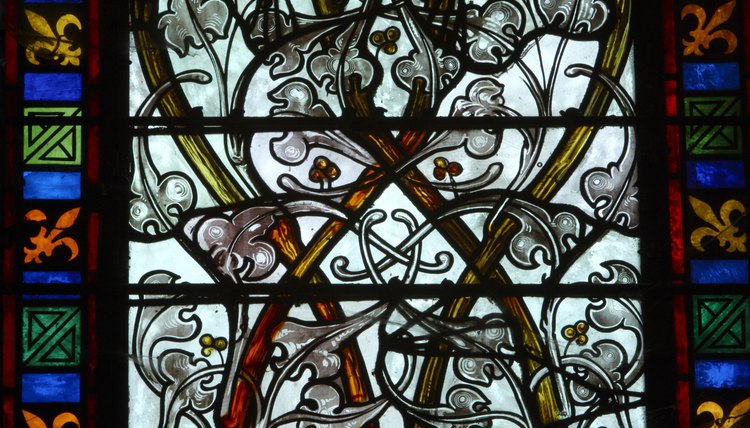 Fleur-de-lis on a stained glass window in France.