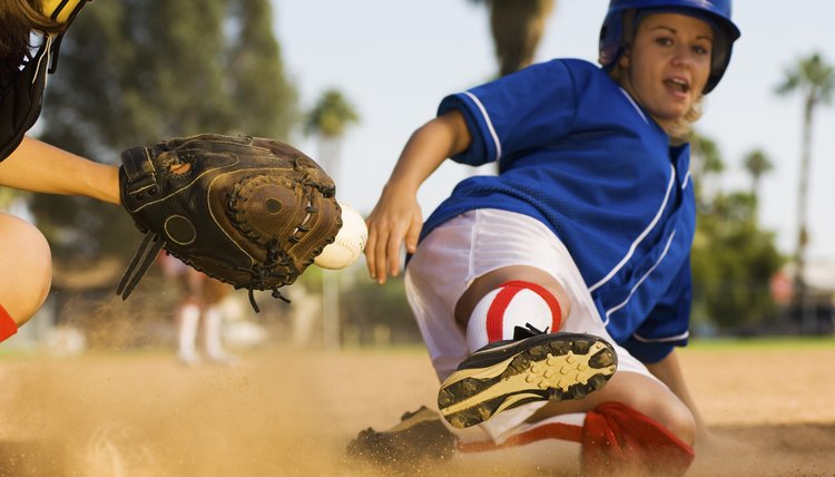 Runner Sliding Home as Catcher Grabs Softball