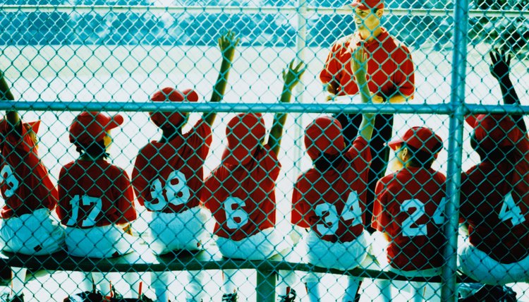 Little League Team and Coach in Dugout