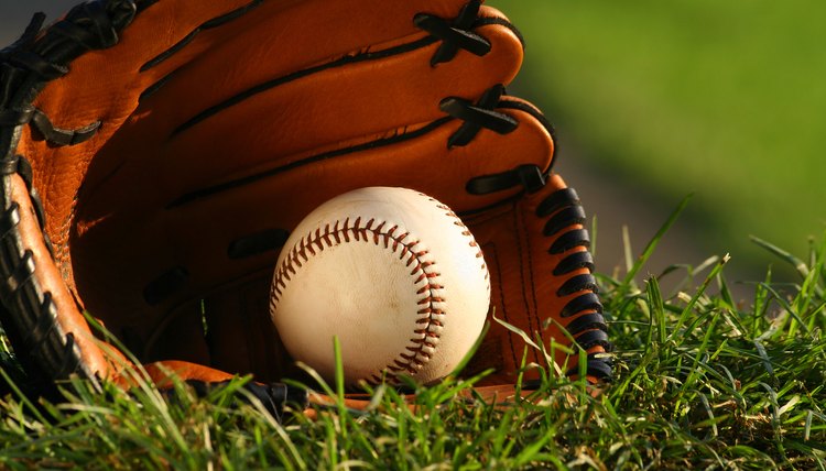 Baseball and glove on the grass