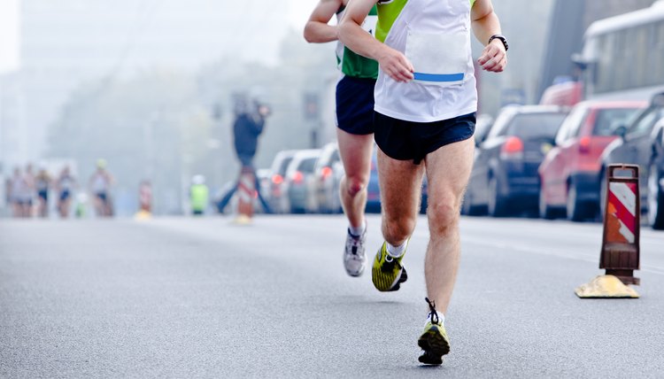 People running in city marathon