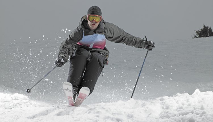 Skier, skiing down slope