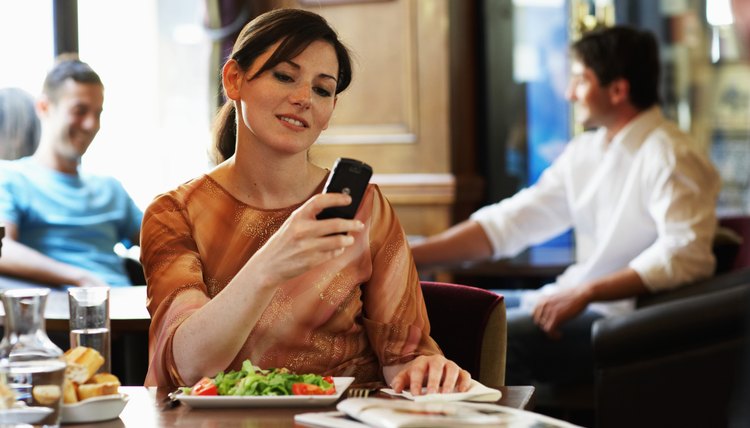 woman reading text message from date