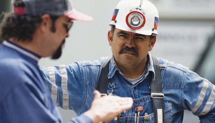 Petroleum engineers oversee some operations on site.