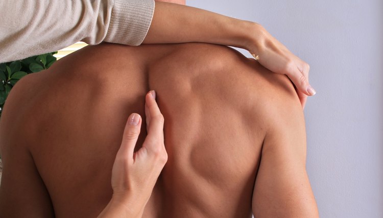 Man having chiropractic back adjustment close up. Osteopathy, Alternative medicine, pain relief concept