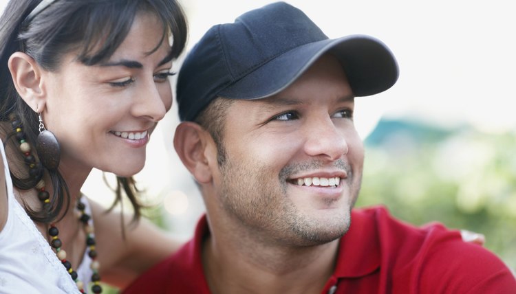 Hispanic woman smiling at husband