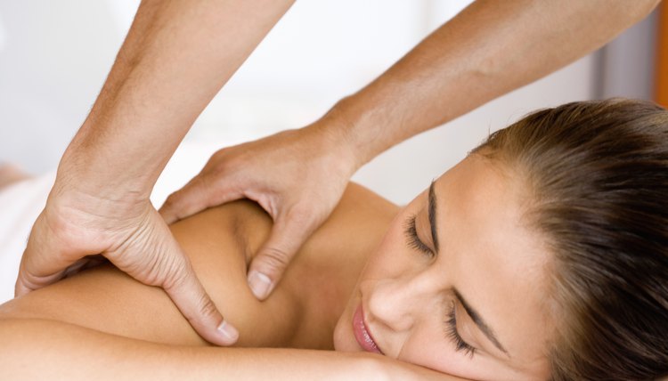 Woman getting a massage at spa