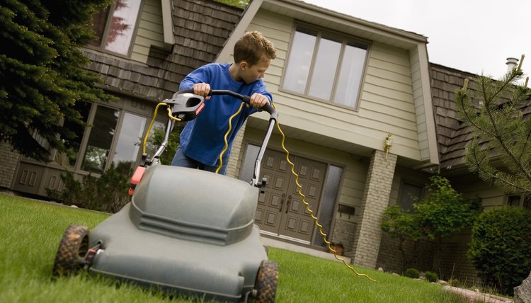 A young boy is doing chores around the house.