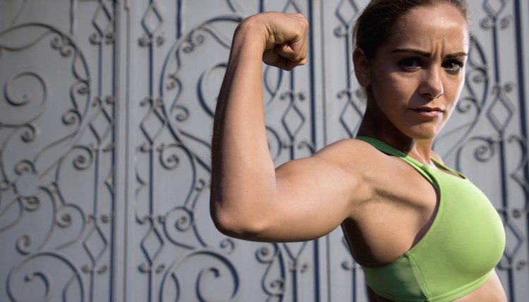 Close up of woman flexing biceps