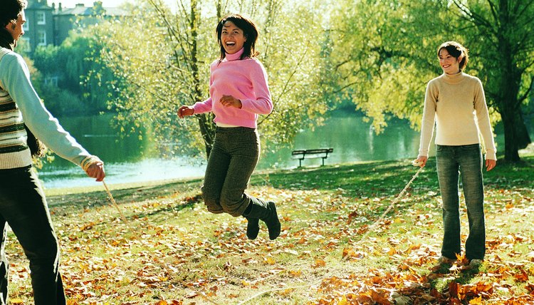Young Man and Woman Holding a Skipping Rope in a Park and a Portrait of a Young Woman Skipping