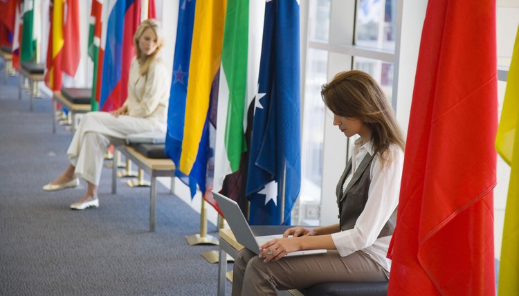 Women with laptop and international flags