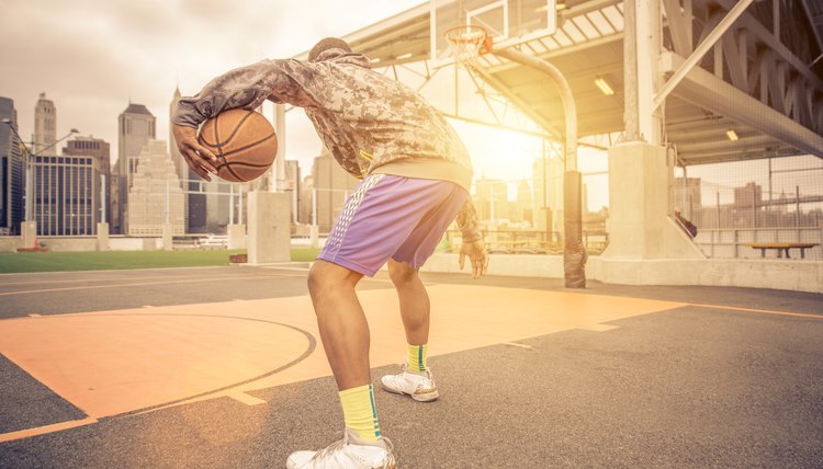 Basketball player training on the court