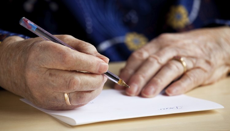 Senior woman writing a letter.