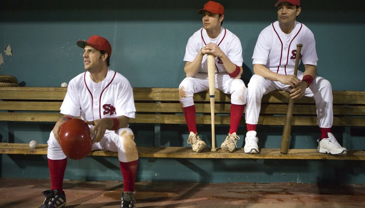 USA, California, San Bernardino, baseball players sitting in dugout