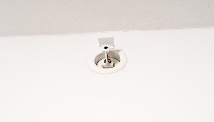 Sprinkler on wall near ceiling