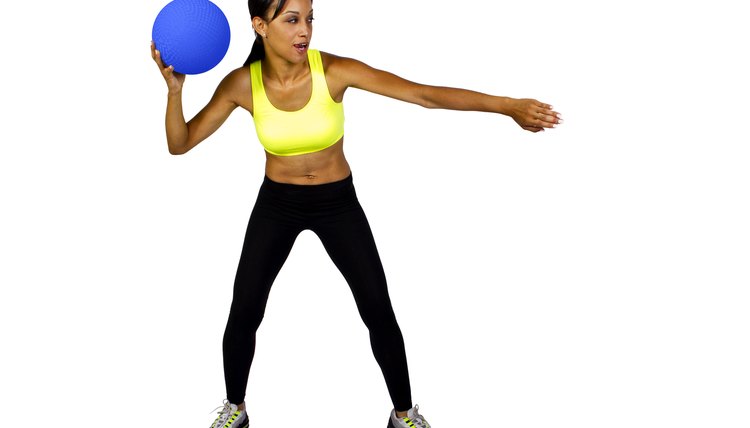 young African American Female holding a dodge ball