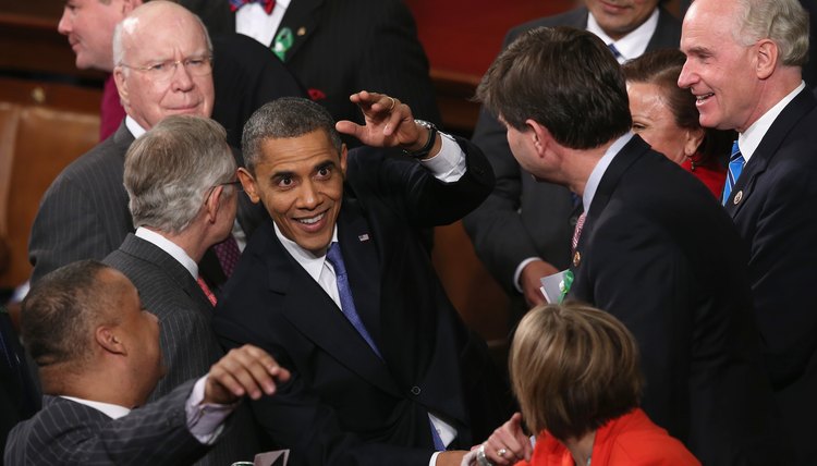 President Obama is seen here greeting members of Congress after a State of the Union speech.
