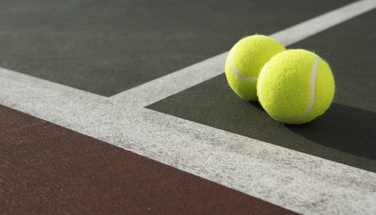 Two tennis balls on tennis court, elevated view