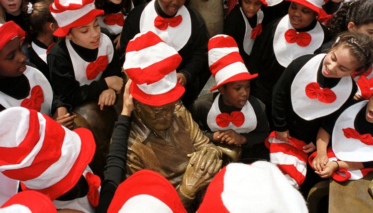 Children visit a statue of Theodor Geisel at a sculpture museum in his honor in Springfield, Massachusetts.