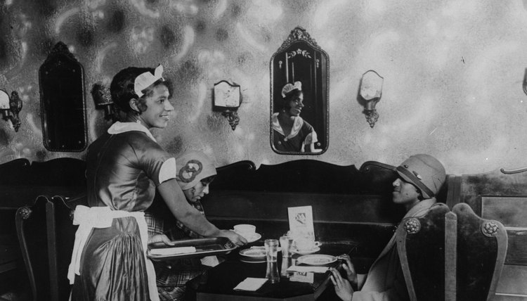 Harlem Renaissance women often adorned their bell-shaped cloche hats with appliqués, feathers, flowers or brooches.