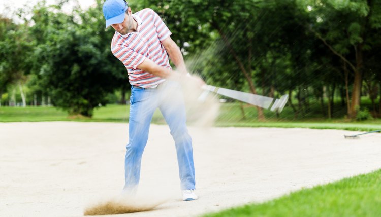 Golfer taking a bunker shot