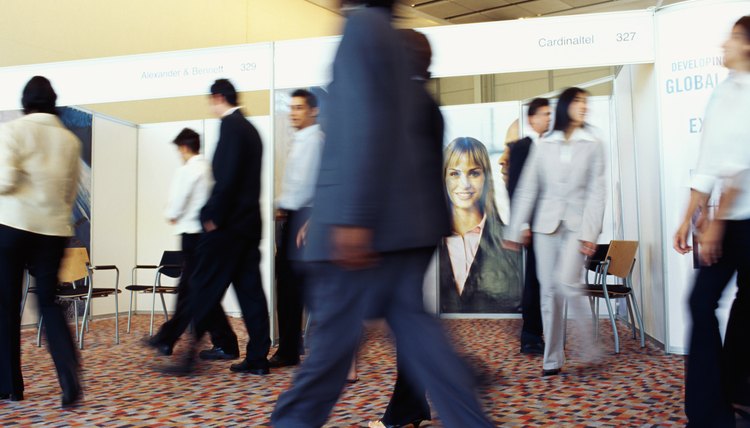 Walking by booths at trade show