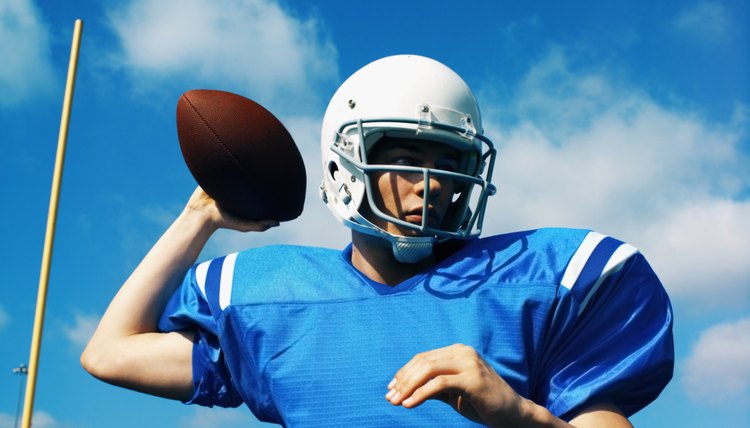 American football player (16-20) about to throw football