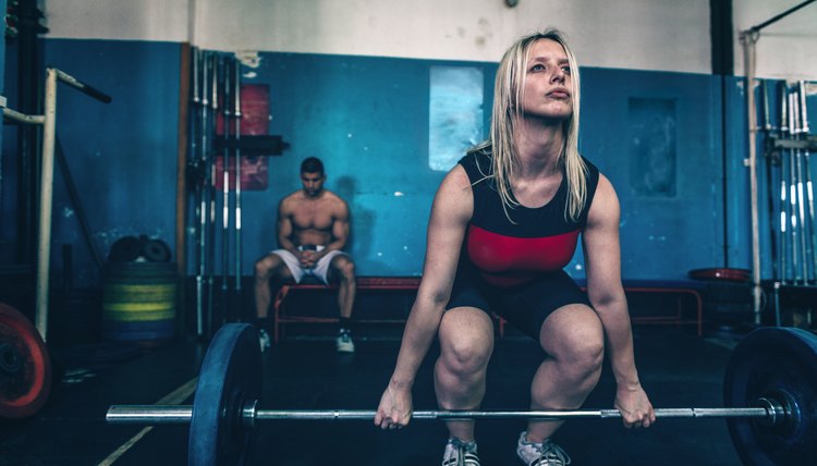 Weightlifting gym, athletes in training